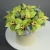 Композиция в шляпной коробке из 11 лаймовых орхидей в Бронницах